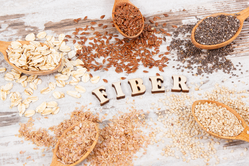 The word FIBER surrounded by oats, seeds, and grains