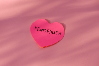 MENOPAUSE written on heart-shaped note paper