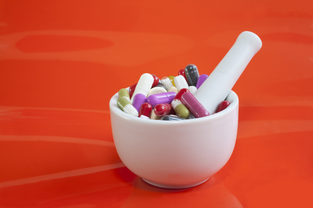 assorted pills in mortar and pestle